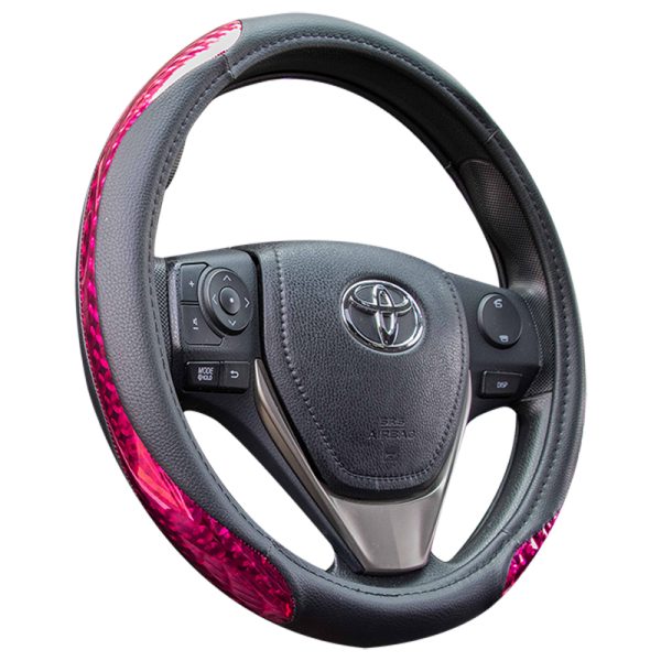 Pink glitter steering wheel cover with black PU leather, angled view