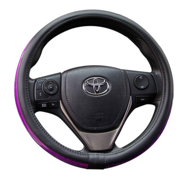 Purple auto steering wheel cover on car wheel