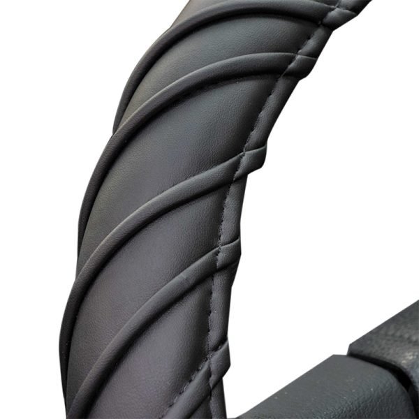 Close-up of spiral stitch steering wheel cover texture in PU leather