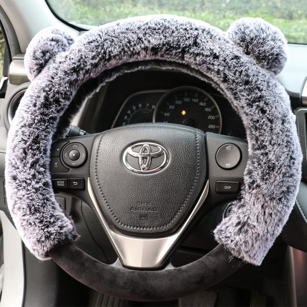teddy bear steering wheel cover installed in car interior