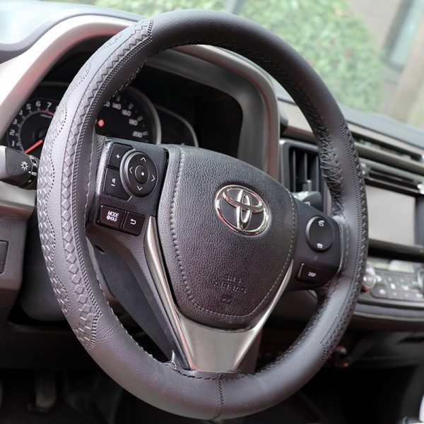 DIY sewing steering wheel cover stitched on car wheel
