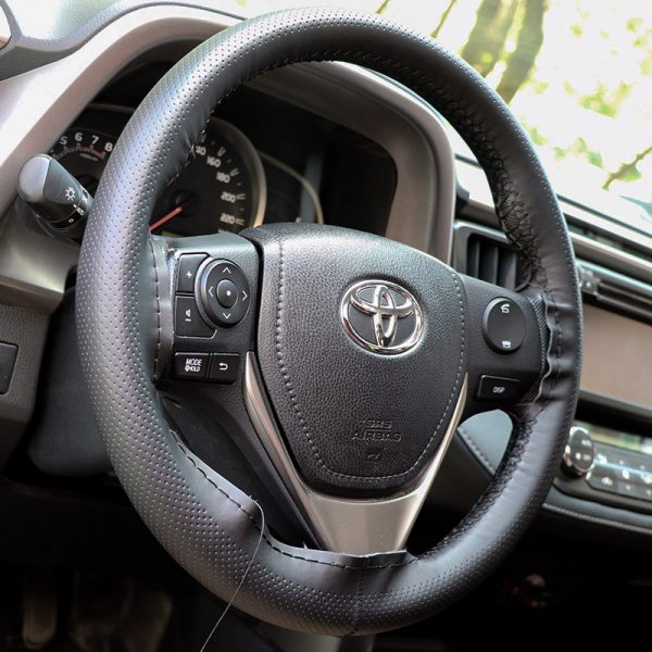 Side view of installed leather hand stitched steering wheel cover