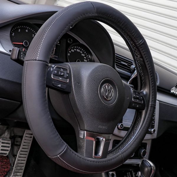Front view of a steering wheel with a premium black leather cover
