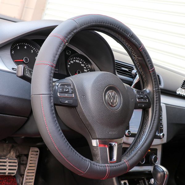 Red stitched leather steering wheel cover in Volkswagen