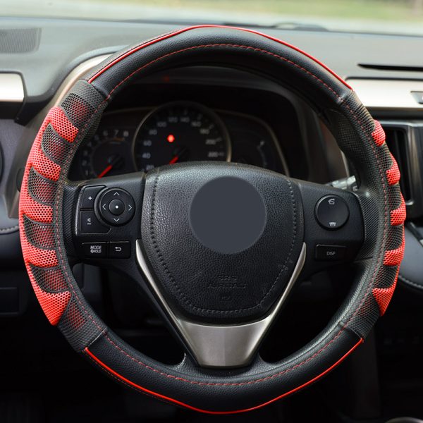 Front view of red and black 3D honeycomb steering wheel cover in car interior