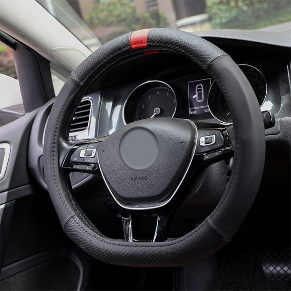 Flat bottom sport steering wheel cover 80626 installed in a car with black panels and a red center stripe