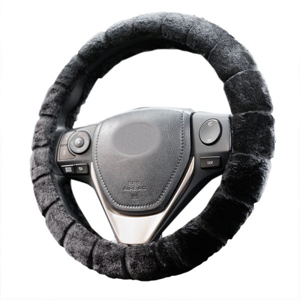 Alternate view of a dark short plush steering wheel cover with segmented styling on a steering wheel